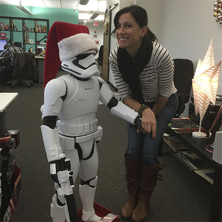 Jenn Calvi posing for a photo-op with Santa Stormtrooper 