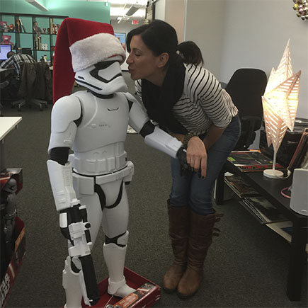 Jenn Calvi under the mistletoe with Santa Stormtrooper