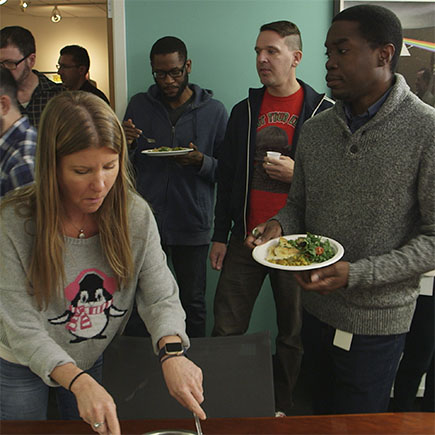 Some of the team checking out our delicious potluck spread