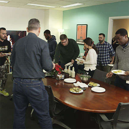 Some of the team enjoying our 2018 holiday potluck lunch