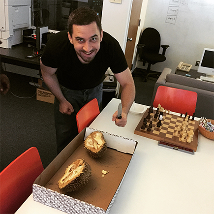 Harun cuts into the Durian fruit, the smelliest fruit in the world. We’re serious, look it up.