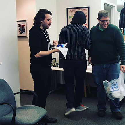 Nick R., Shaq, and John L. enjoy the White Castle feast.